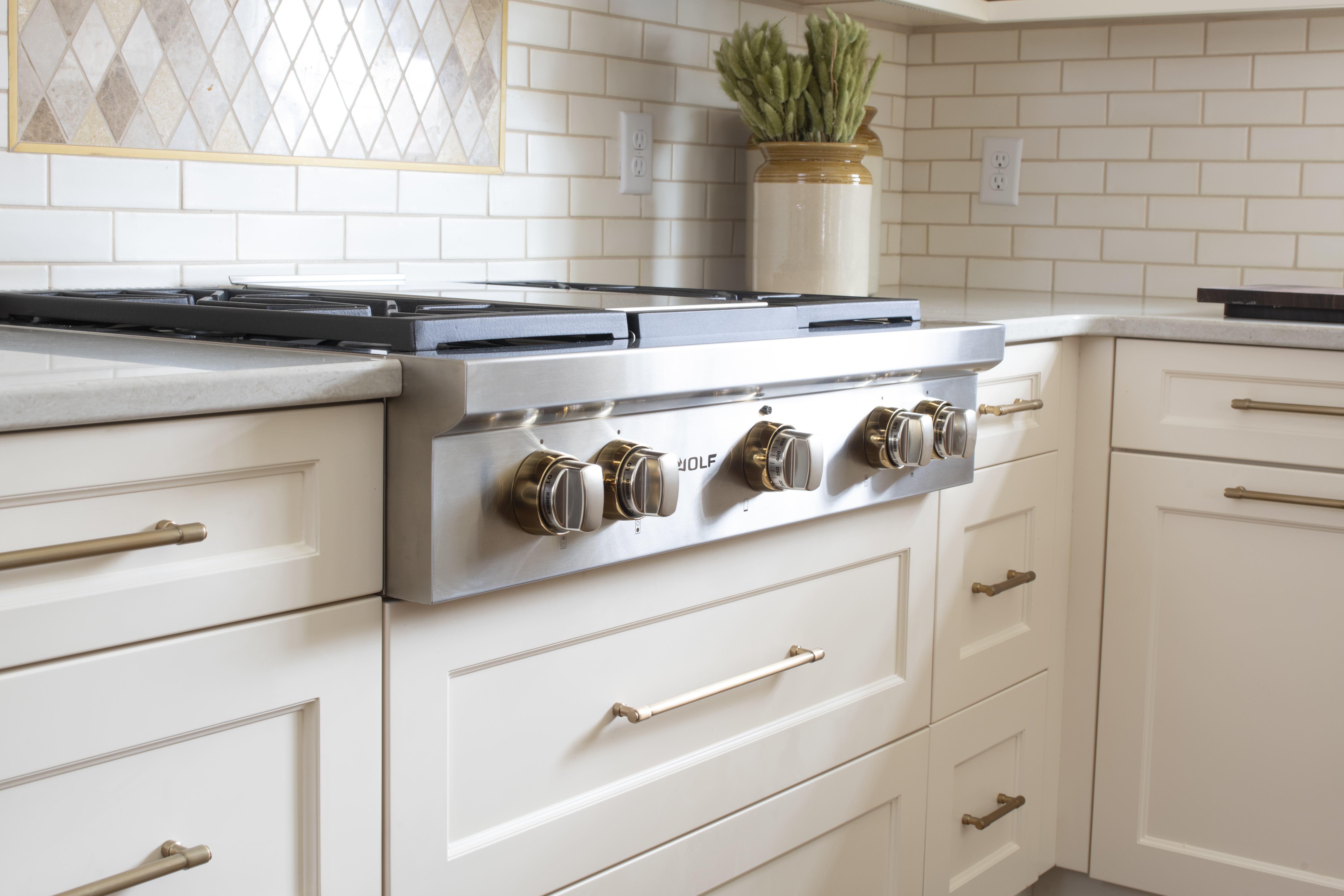 Brass Knobs on Wolf Range in Kitchen